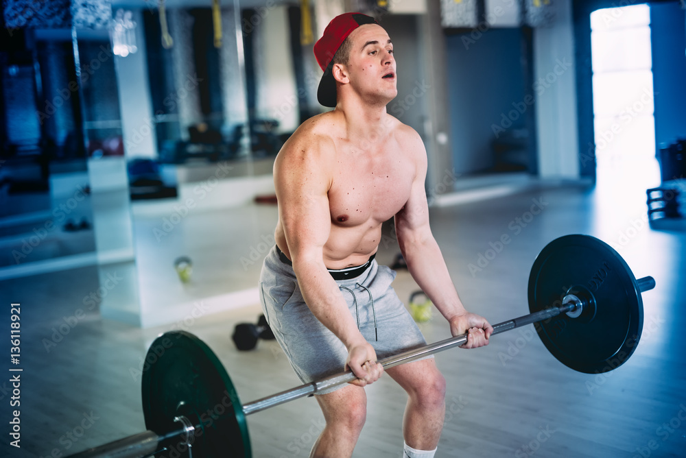 close up portrait of a muscular male, workout with barbell at training facility, at the gym close up portrait of a muscular male, workout with barbell at training facility, at the gym