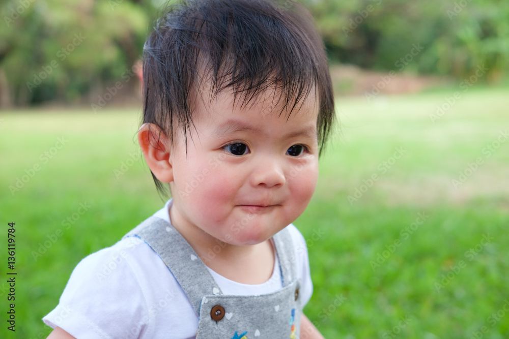 Cute Baby girl playing in the garden, close-up portrait, Portrait of a beautiful baby girl Cute Baby girl playing in the garden, close-up portrait, Portrait of a beautiful baby girl