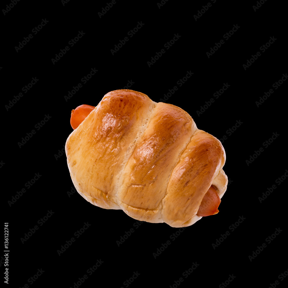 Bread with Sausage. Studio shot isolated on black Bread with Sausage. Studio shot isolated on black