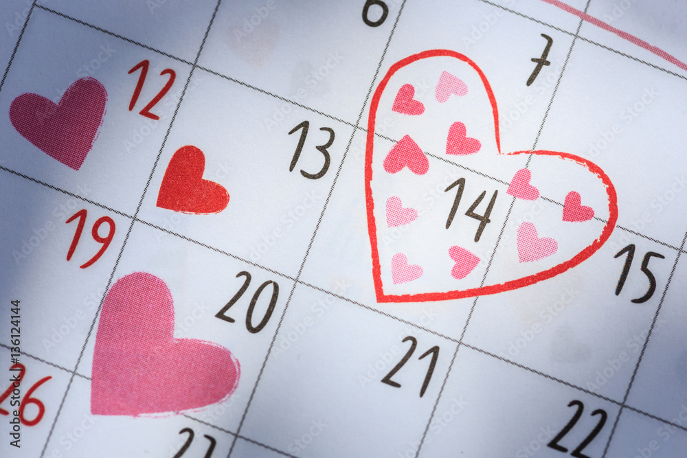Date 14 in calendar with heart sign. Valentine day and love conc Date 14 in calendar with heart sign. Valentine day and love conc