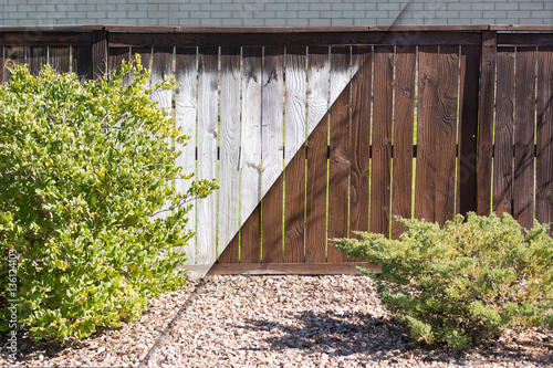 Photography Yard Fence Before and After Solid Paint Stain Application.