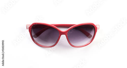 Red sunglasses isolated over a white background .