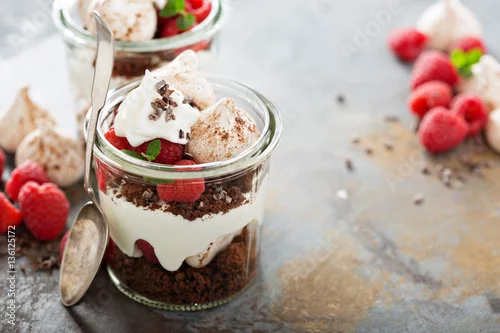 Obraz  z motywem Layered dessert with chocolate cake and whipped cream