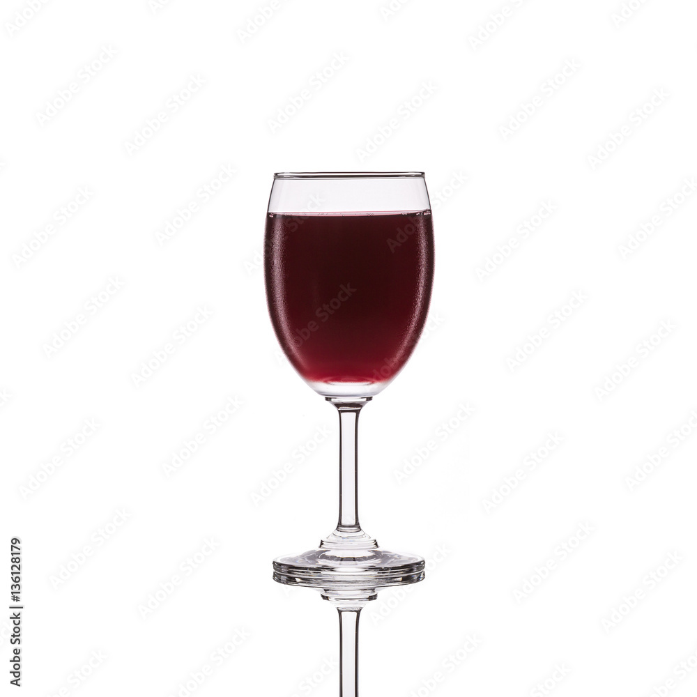 Red wine in glass. Studio shot isolated on white Red wine in glass. Studio shot isolated on white