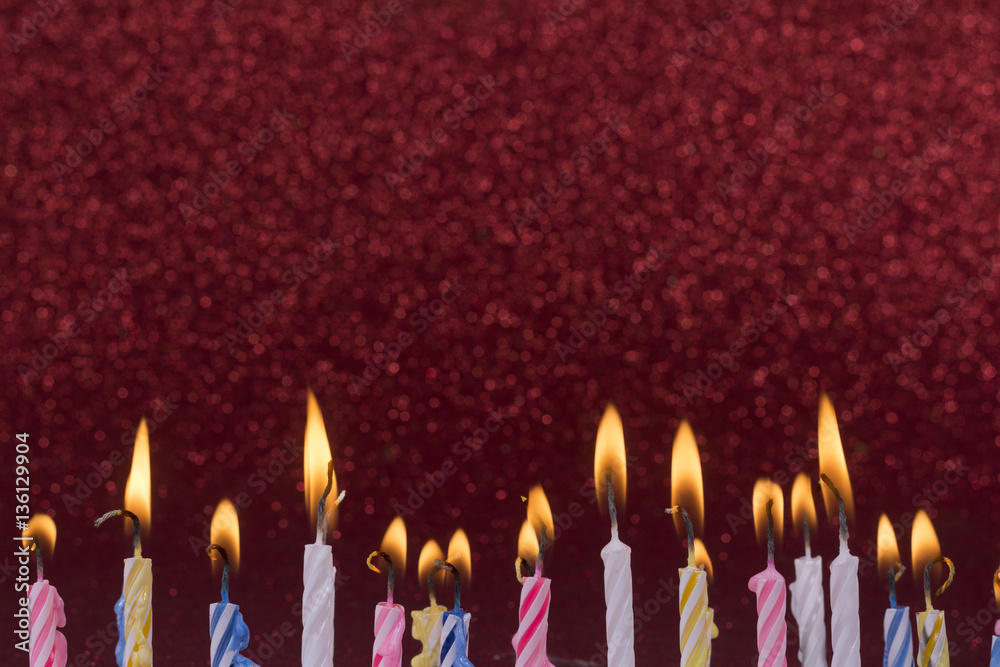 colorful birthday candles composition with shiny red frame