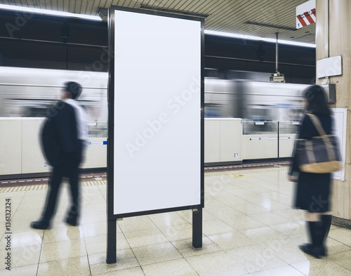 Obraz na plátně Blank Billboard Banner in Subway station with blurred people Commuter Travel con