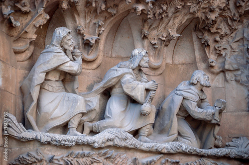 The statues of three wise men on the facade of Sagrada Familia in Barcelona, Spain