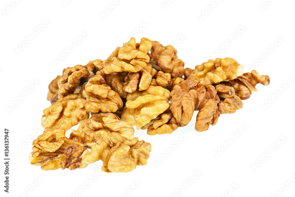 Handful of walnuts isolated on white background. Closeup. Selective focus. Handful of walnuts isolated on white background. Closeup. Selective focus.