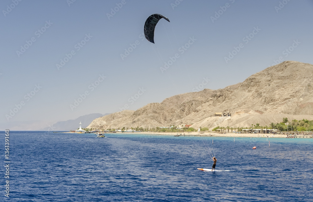 Obraz premium Eilat is a perfect vacation spot suitable for blend of fun, sun, diving, water sport and relaxing by sandy beaches