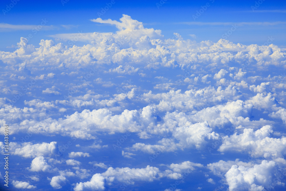 Fototapeta premium Skyline View above the Clouds from air plane