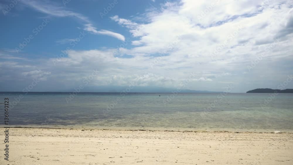 Beach, sea, sand,wave. Tropical beach, blue sky, clouds. Seascape ocean and beautiful beach paradise.Philippines 4K video Travel concept Beach, sea, sand,wave. Tropical beach, blue sky, clouds. Seascape ocean and beautiful beach paradise.Philippines 4K video Travel concept