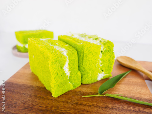Bakery of green tea cake on wooden plate