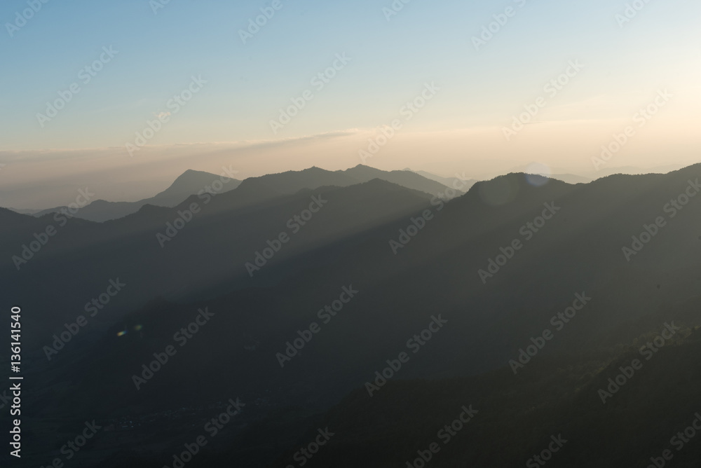 Silhouette of Mountain Layers with sunlight