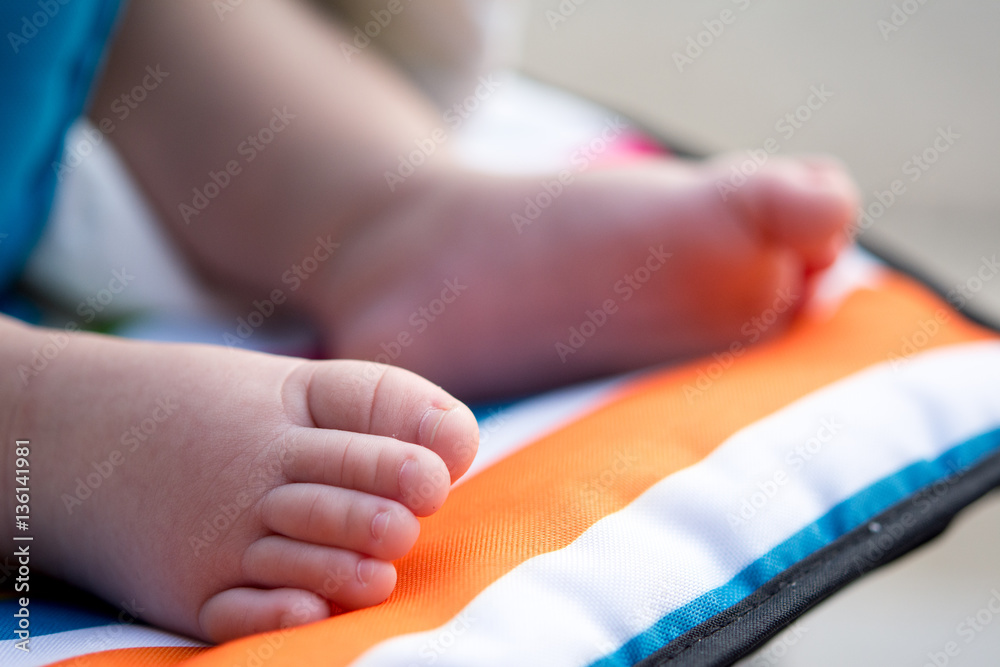 A close-up of tiny baby feet, selection focus