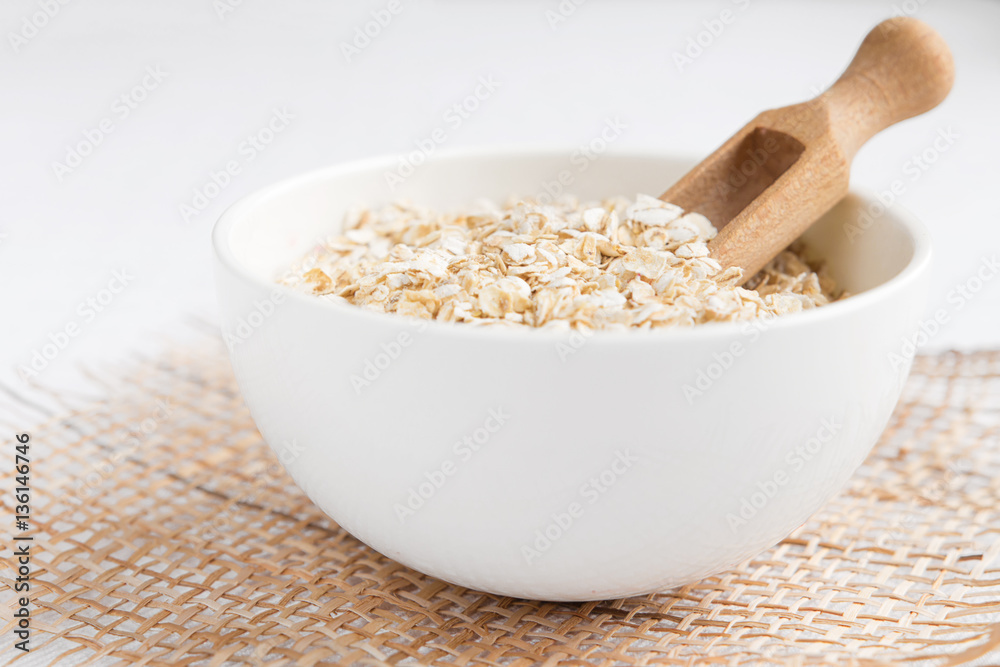 Rolled oats, porridge and cranberries for a healthy breakfast in a rustic style Rolled oats, porridge and cranberries for a healthy breakfast in a rustic style