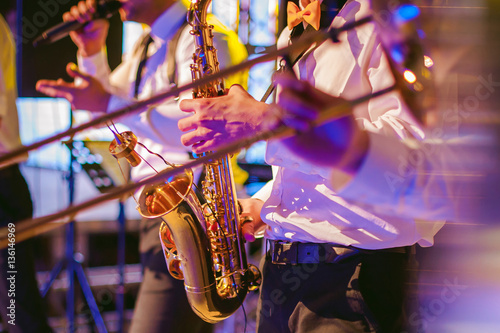 musician plays the saxophone performance at a concert