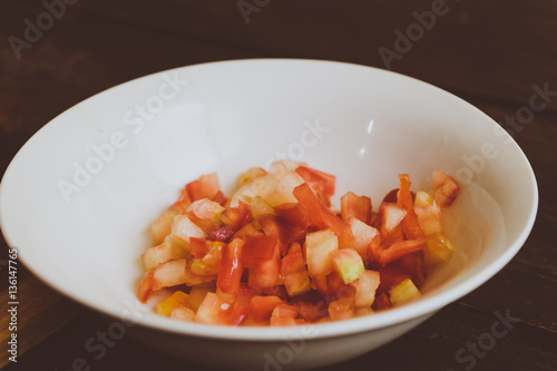 Tomates machacados y partidos para receta de un chirmol, comida Guatemalteca. photo