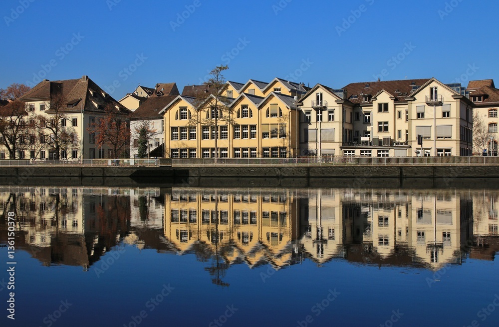 Row of houses mirroring in the Rhine