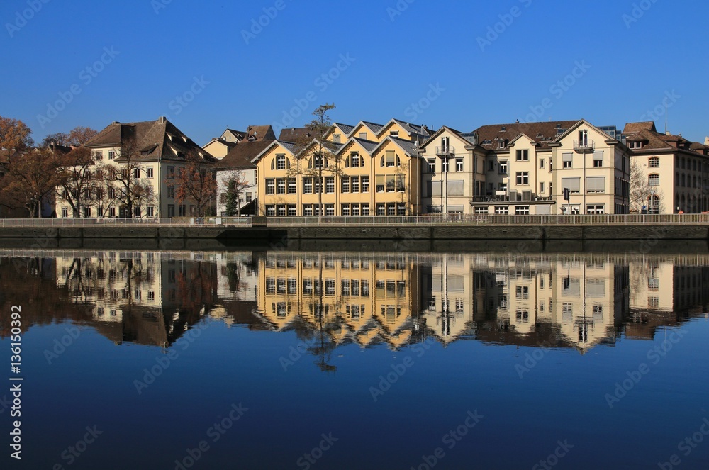 Row of houses in Schaffhausen reflecting in the Rhine