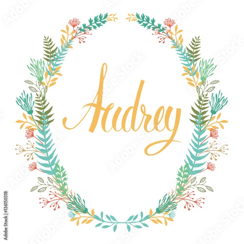Frame of flowers and ferns with girl's name Audrey photo