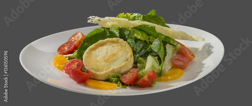 salad of lettuce with zashecheno goat cheese and parmesan cheese