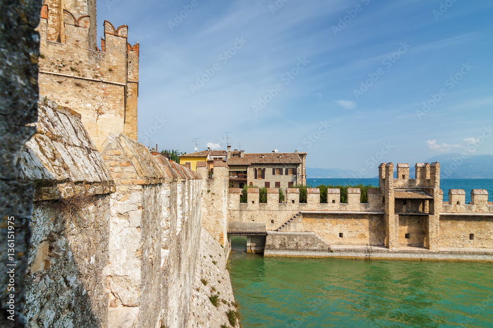 Sunny view of castle Rocca di Sirmione at Garda lake, Lombardia region, Italy.