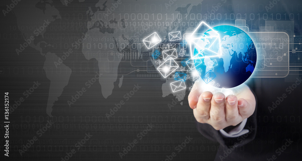 Business woman hand holding E-mail marketing with world Business woman hand holding E-mail marketing with world