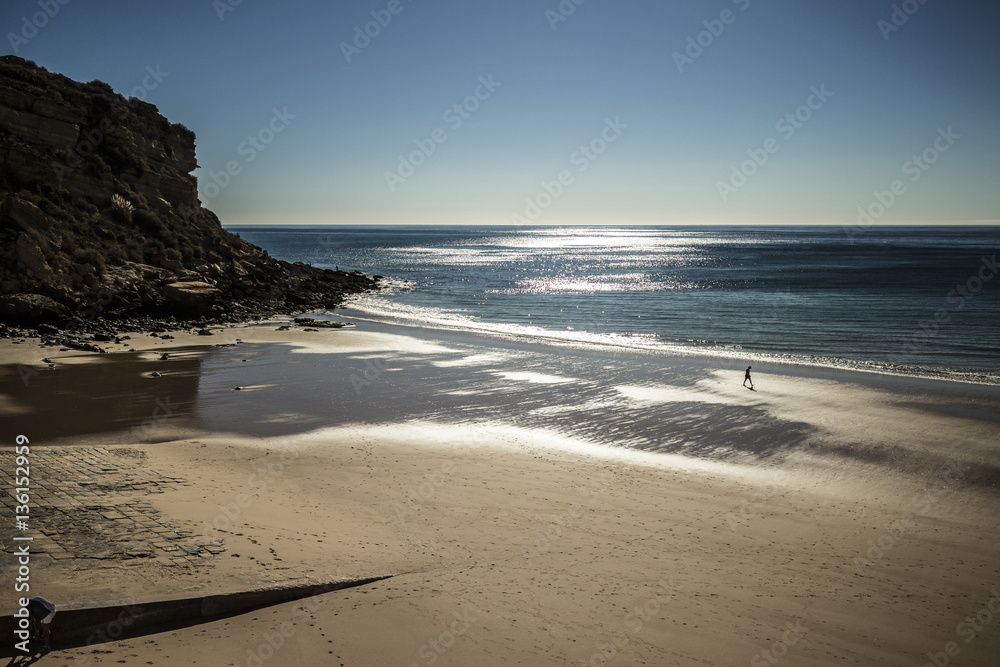 A man on a beach, Algarve, Portugal