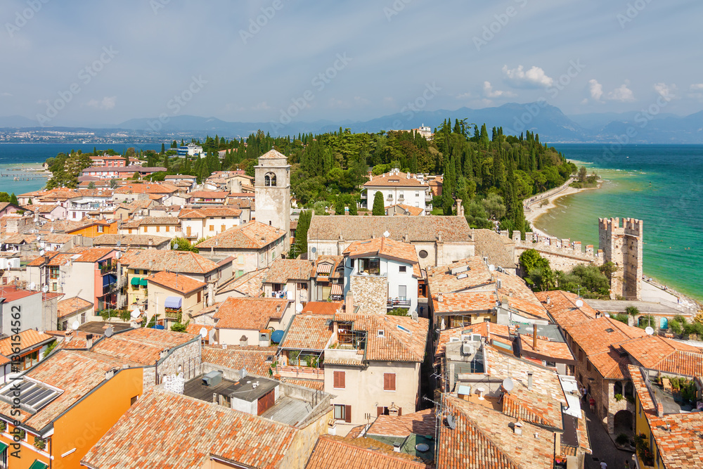 Sunny view of town from viewpoint of Rocca di Sirmione at Garda lake, Lombardia region, Italy.