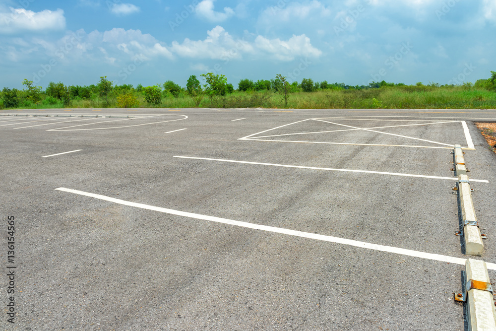 Empty parking lot on blue sky background Empty parking lot on blue sky background