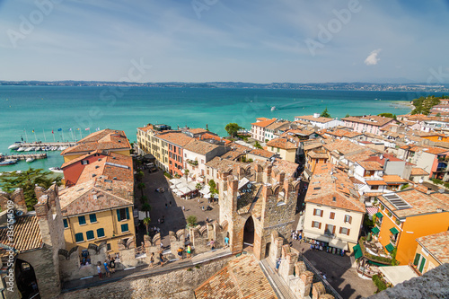 Sunny view of town from viewpoint of Rocca di Sirmione at Garda lake, Lombardia region, Italy. © Neonyn