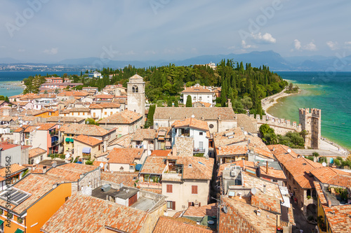 Sunny view of town from viewpoint of Rocca di Sirmione at Garda lake, Lombardia region, Italy.