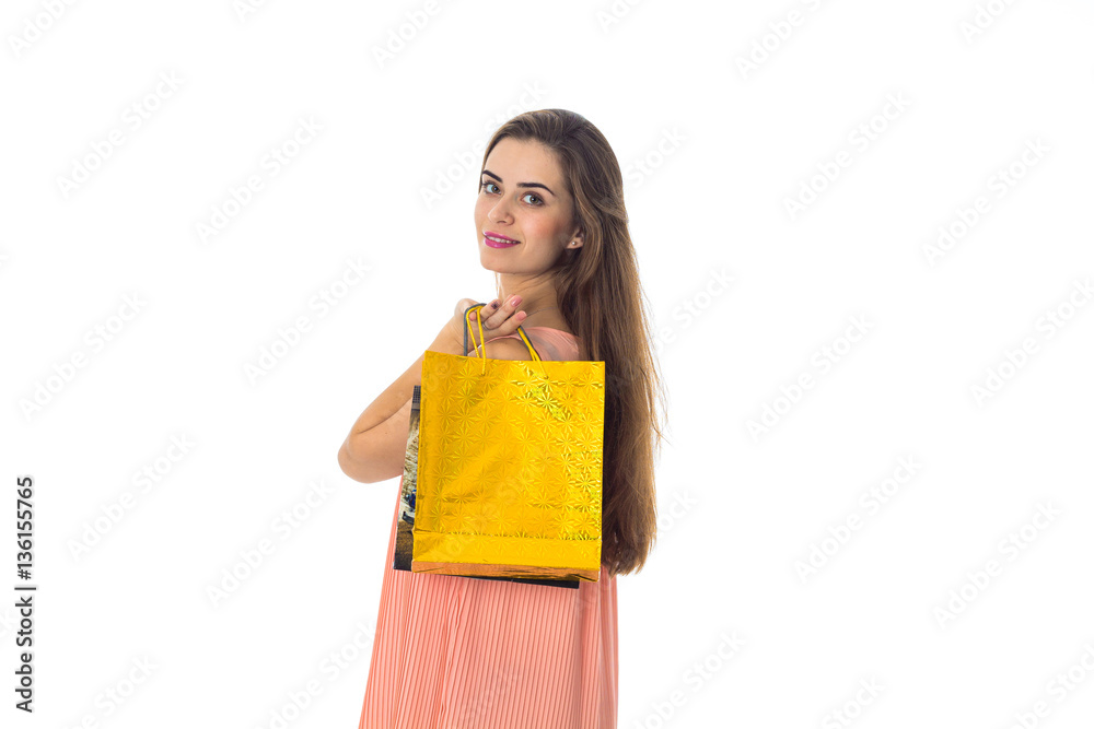 young girl holds large package of yellow front isolated on white background young girl holds large package of yellow front isolated on white background