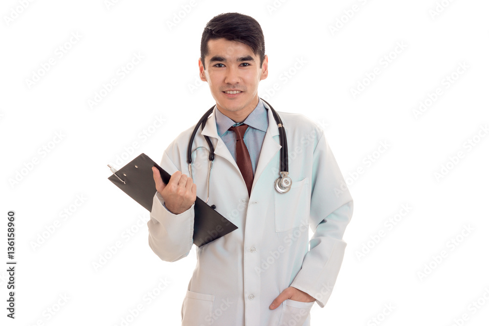 beautiful man doctor posing in uniform isolated on white background in studio beautiful man doctor posing in uniform isolated on white background in studio