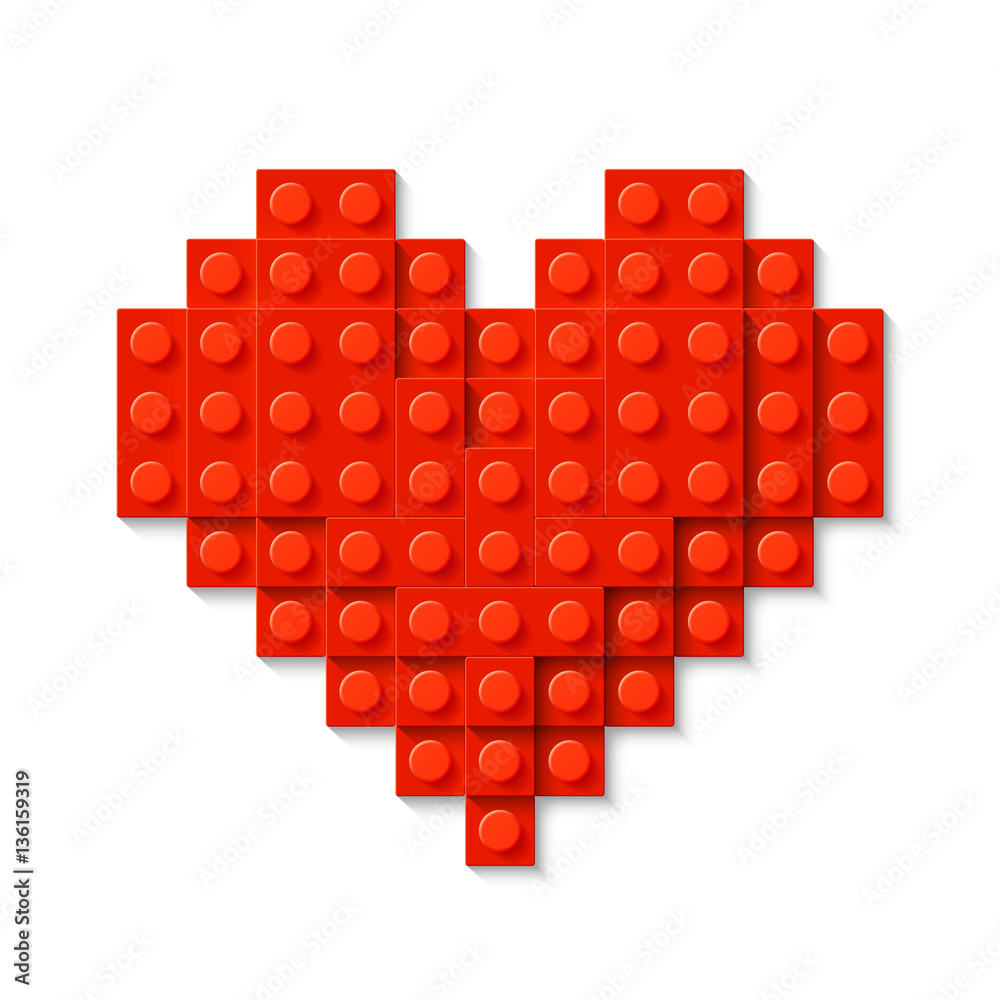 Red heart made of plastic construction blocks