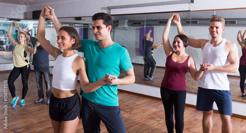 girls and men learning salsa