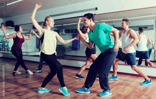 Dancing couples learning swing