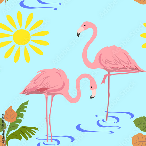 a pair of flamingos in the water