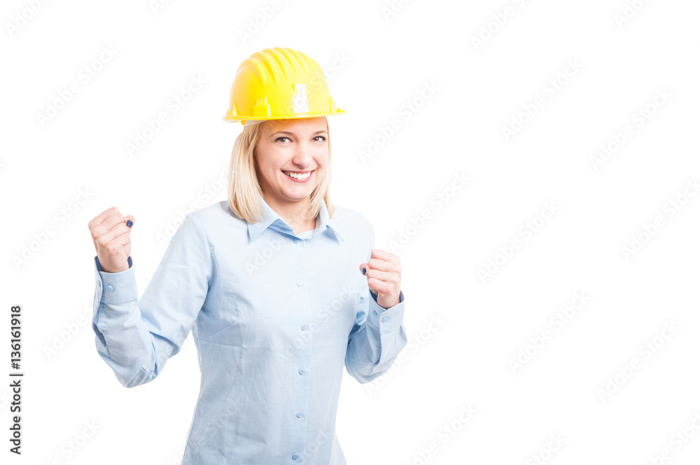 Portrait of smiling female architect making success gesture Portrait of smiling female architect making success gesture