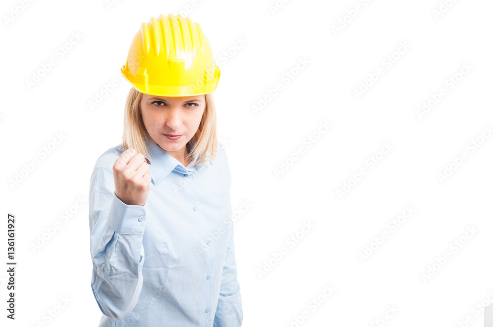 Portrait female engineer making fighting gesture Portrait female engineer making fighting gesture