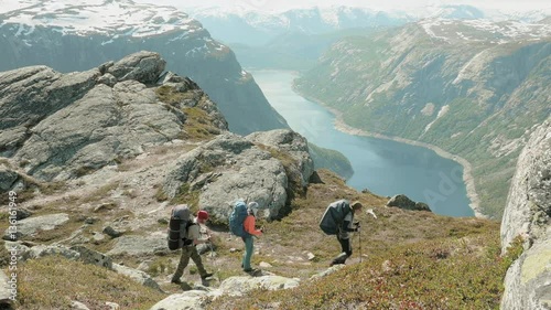 Backpackers go to the Trolltunga in Norway
