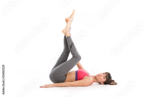 Fototapeta Naklejka Na Ścianę i Meble -  Portrait of attractive woman doing yoga, pilates. Healthy lifestyle and sports concept. Series of exercise poses. Isolated on white.