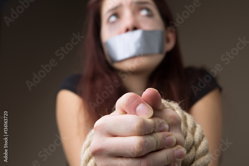Woman gagged and tied hands photo