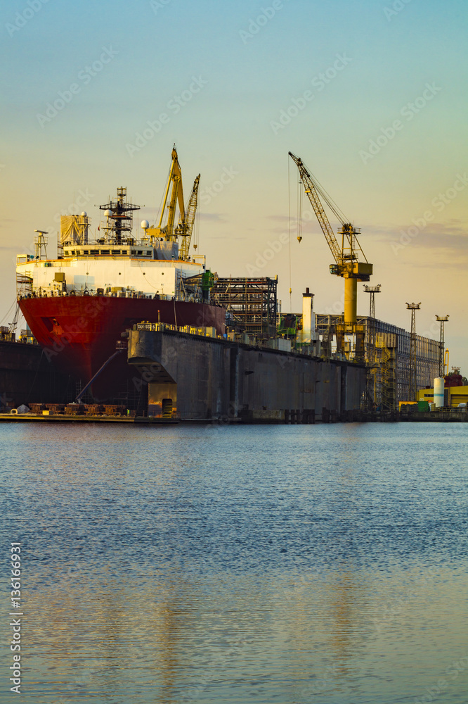 Fototapeta premium merchant ship in the shipyard for repairs in dry dock