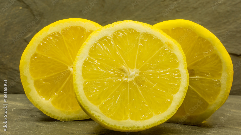 Heap of lemons on a slate table Heap of lemons on a slate table