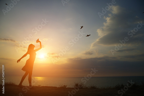 silhouette girl dancing on the background of a beautiful sunset