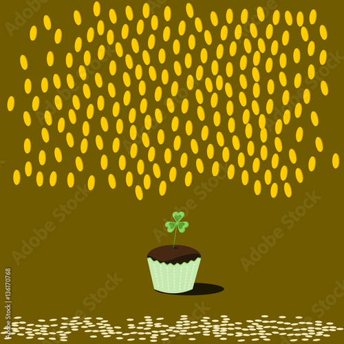 Dark chocolate cupcake in green packaging with clover leaf. Falling many gold coins.