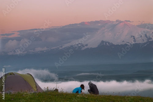 people on the background of mountains of Elbrus