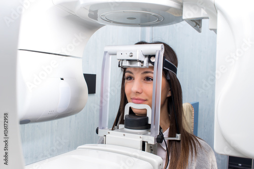 Girl taking digital 3D panoramic dental x-ray. photo