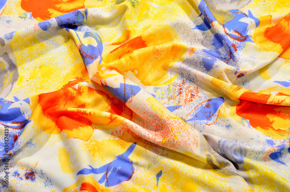 Floral pattern on colorful crumpled fabric.